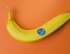 yellow banana on orange surface thumbnail