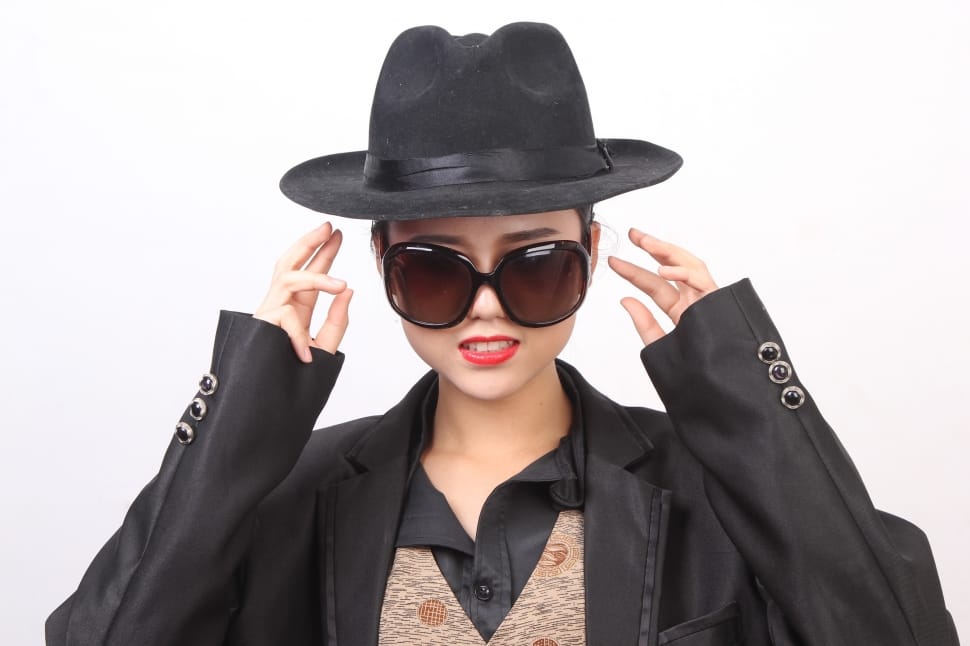 women's black hat and black long sleeve shirt and black sunglasses preview