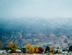 gray and snow covered mountains photo thumbnail