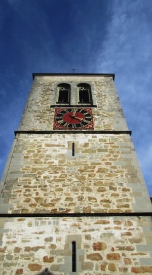 closeup photo of brown concrete tower clock during daytime thumbnail