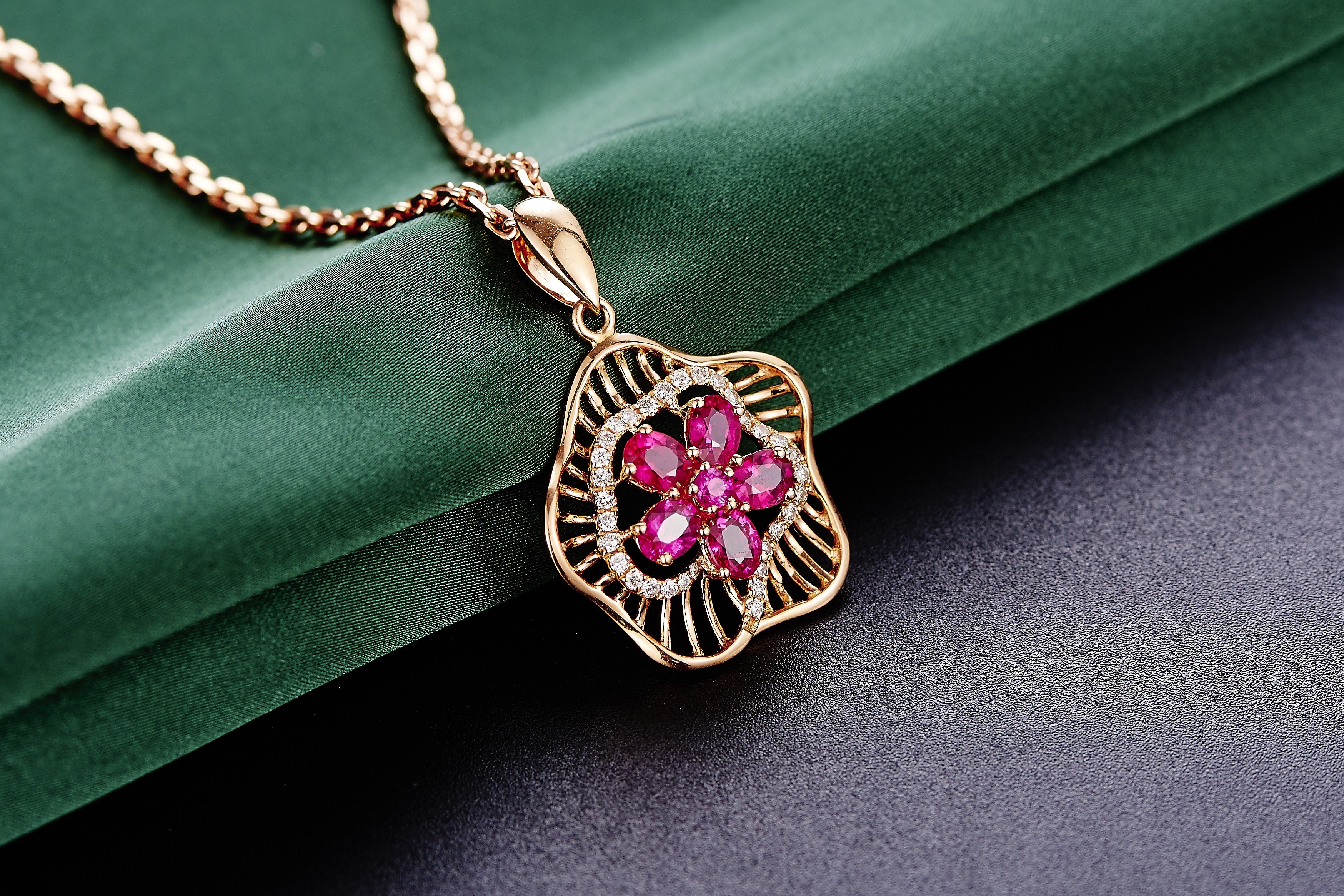 gold and pink pendant necklace