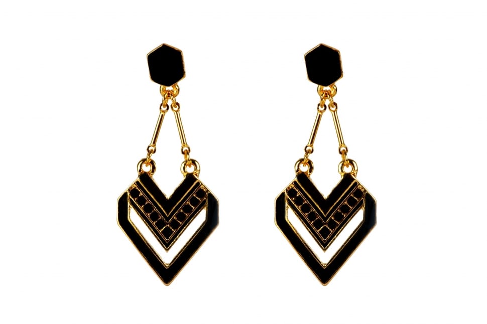 pair of gold and black earrings preview