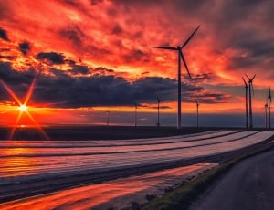 photography of wind turbine during golden hour thumbnail