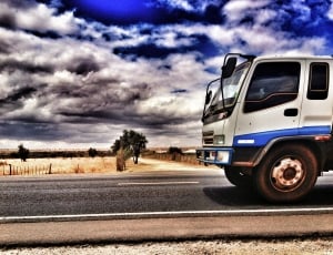 white and blue truck thumbnail