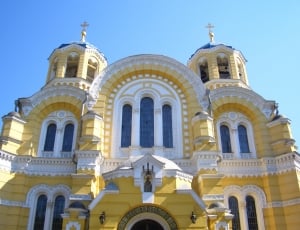 yellow and white painted church thumbnail