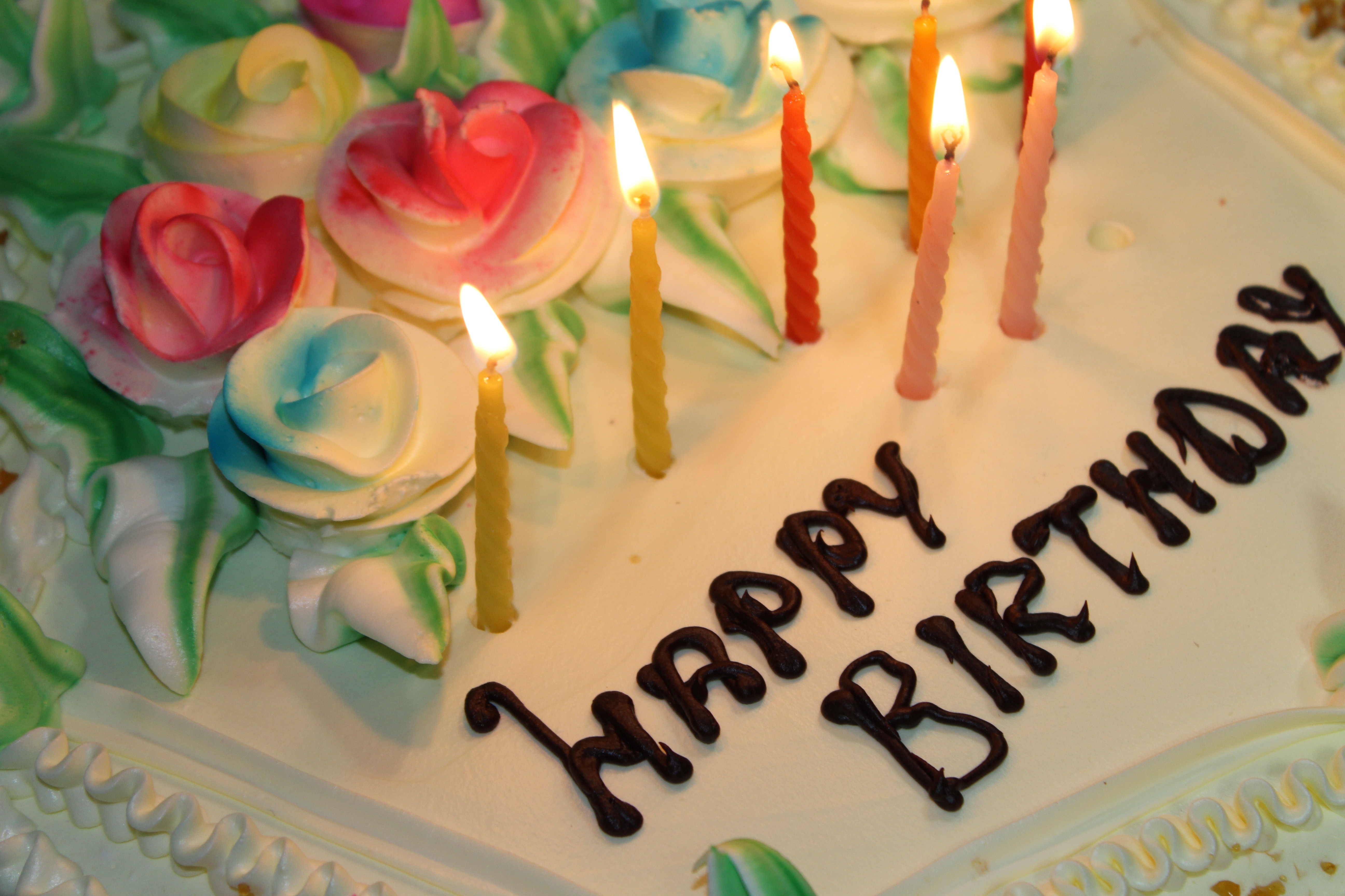 white chocolate cake with happy birthday label