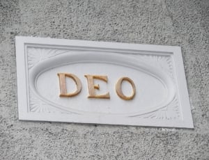 white and abrown deo wooden signage thumbnail