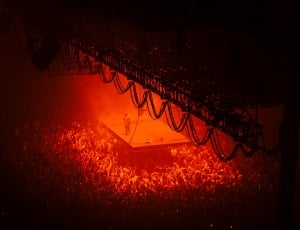 person on stage near on people gathering on concert thumbnail