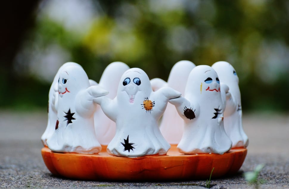 white, black, and orange ghost figurines preview