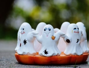 white, black, and orange ghost figurines thumbnail