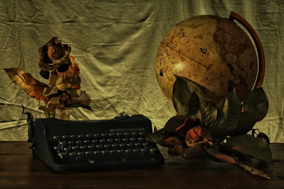black typewriter and globe preview