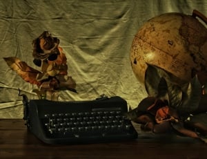 black typewriter and globe thumbnail