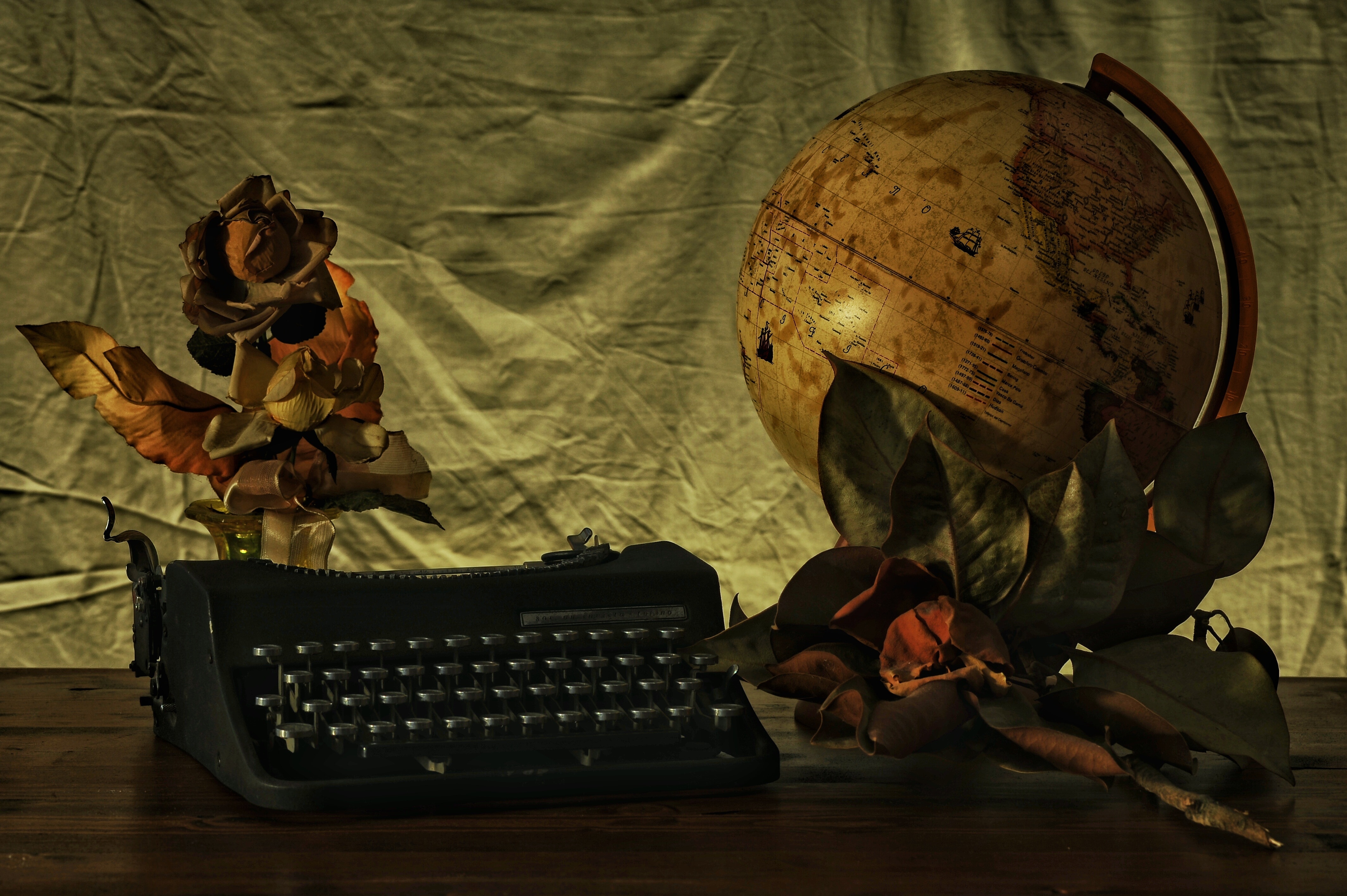 black typewriter and globe