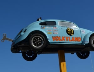 blue volkyland volkswagen beetle signage thumbnail