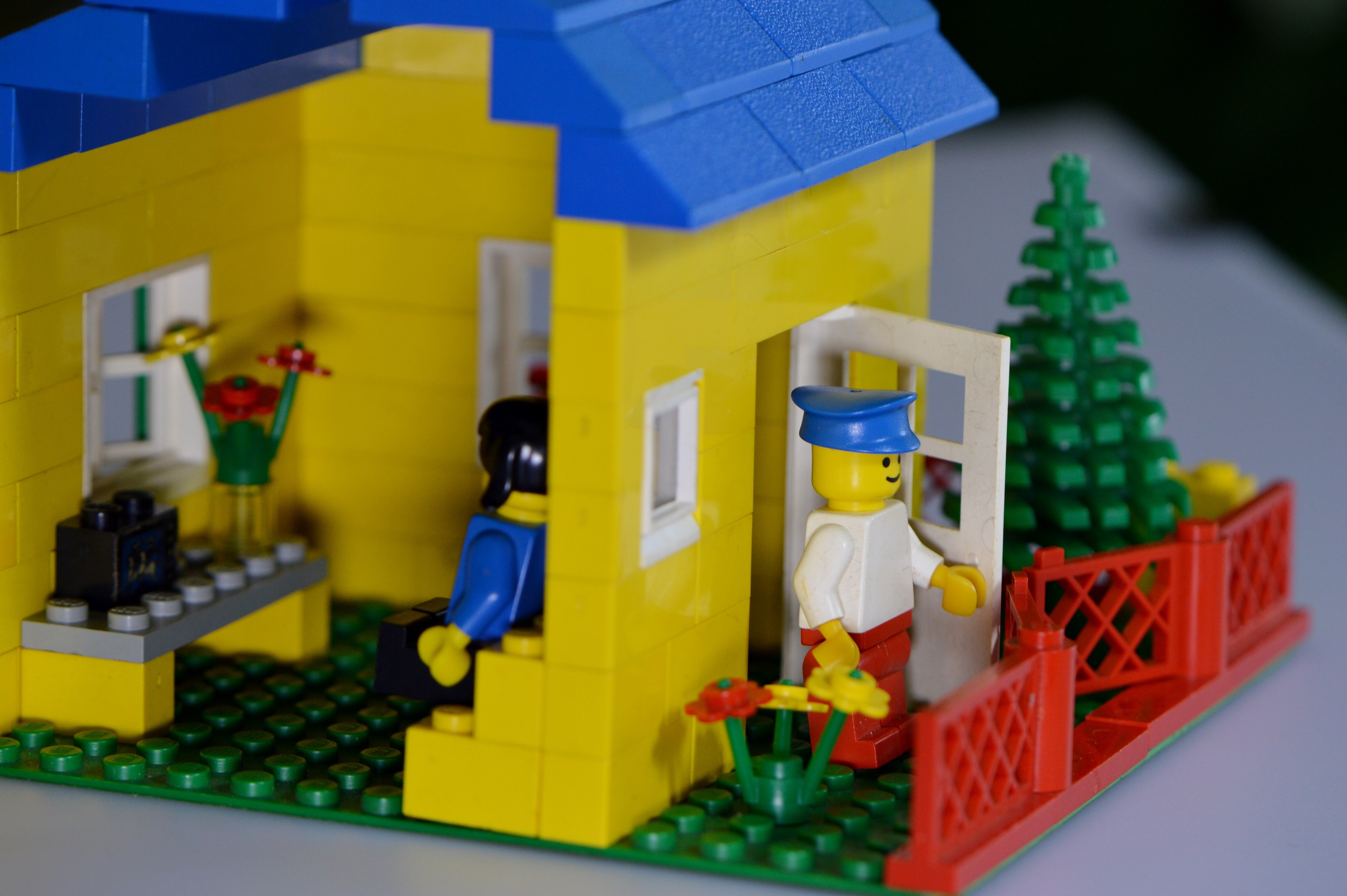 green blue and yellow lego house toy