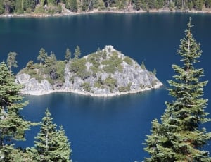 photo of an island in the middle of an lake thumbnail