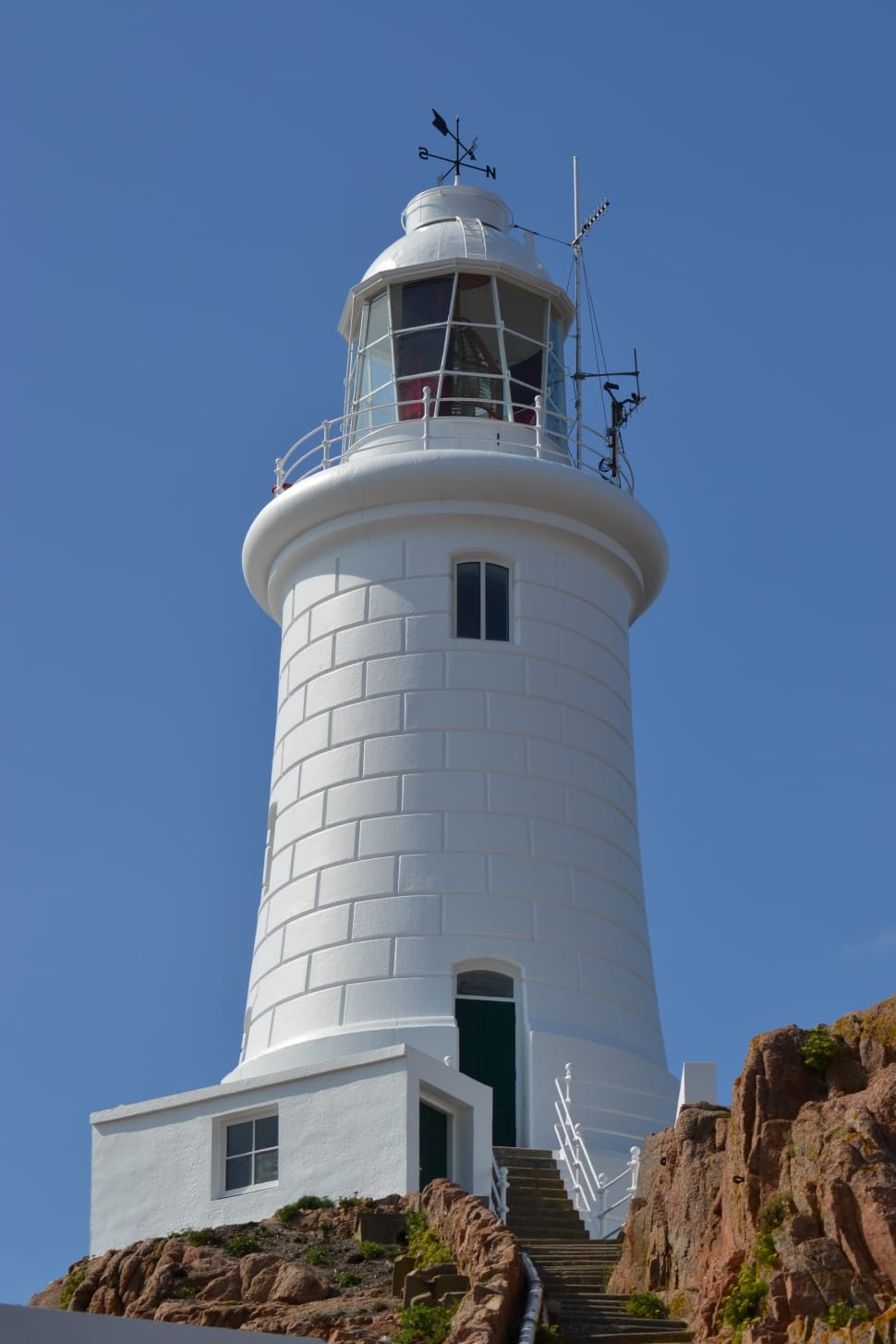 white lighthouse with wind vane preview