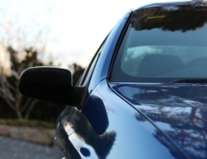 side photo of blue car thumbnail