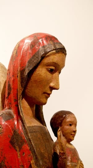 female carrying child figurine thumbnail