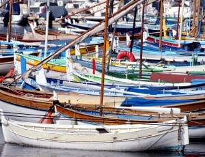 assorted color boats in sea at daytime thumbnail