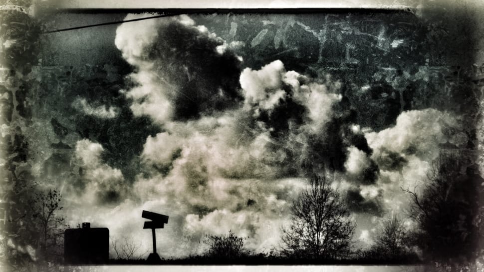 grayscale photo of post under clouds preview