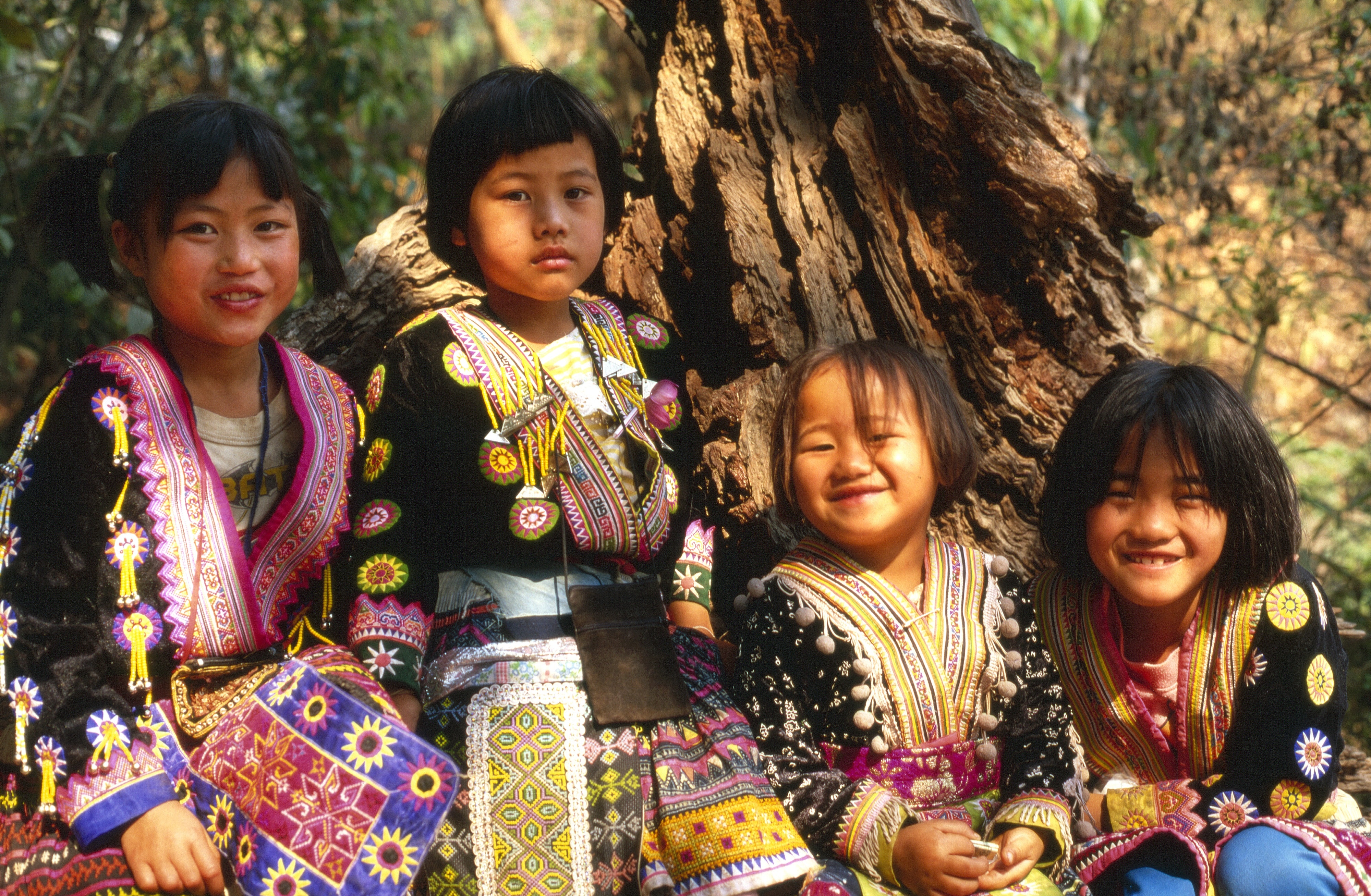 four girls in tribal suit