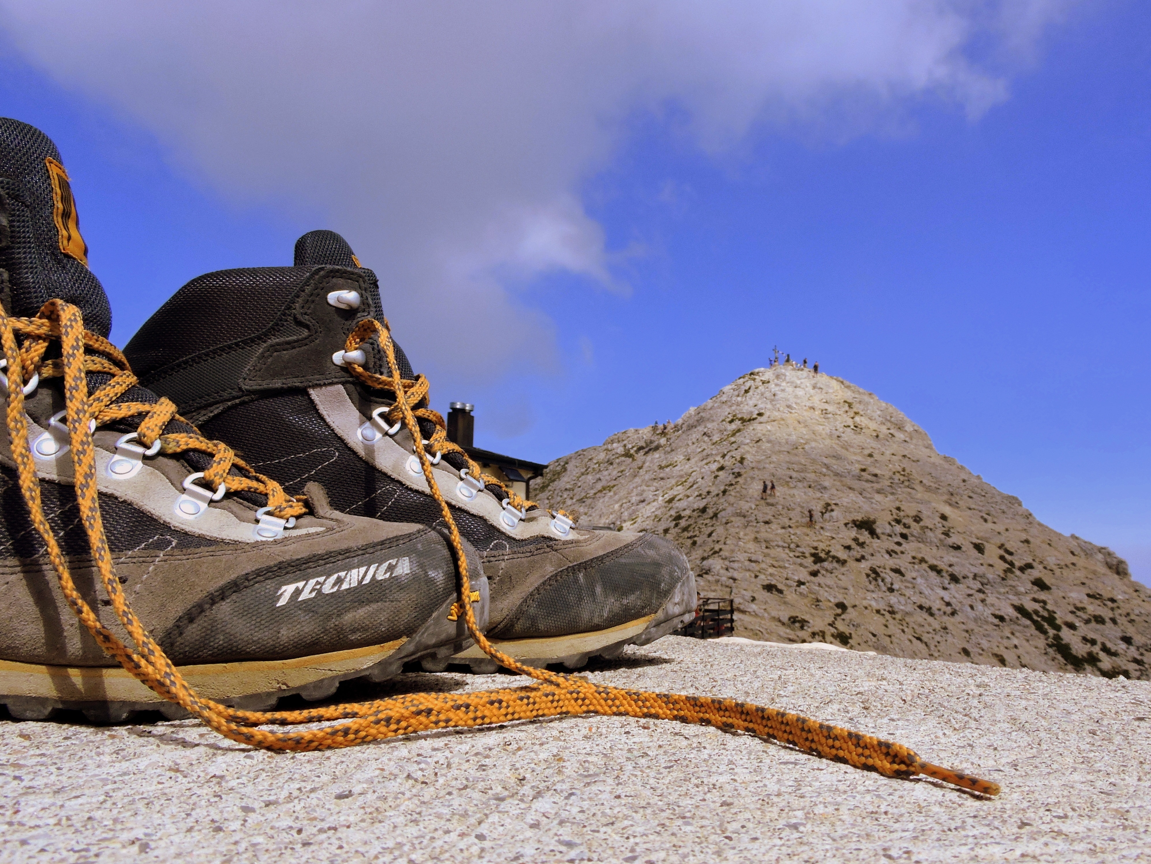 brown and black tecnica hiking shoes