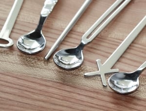 three spoon on brown table thumbnail