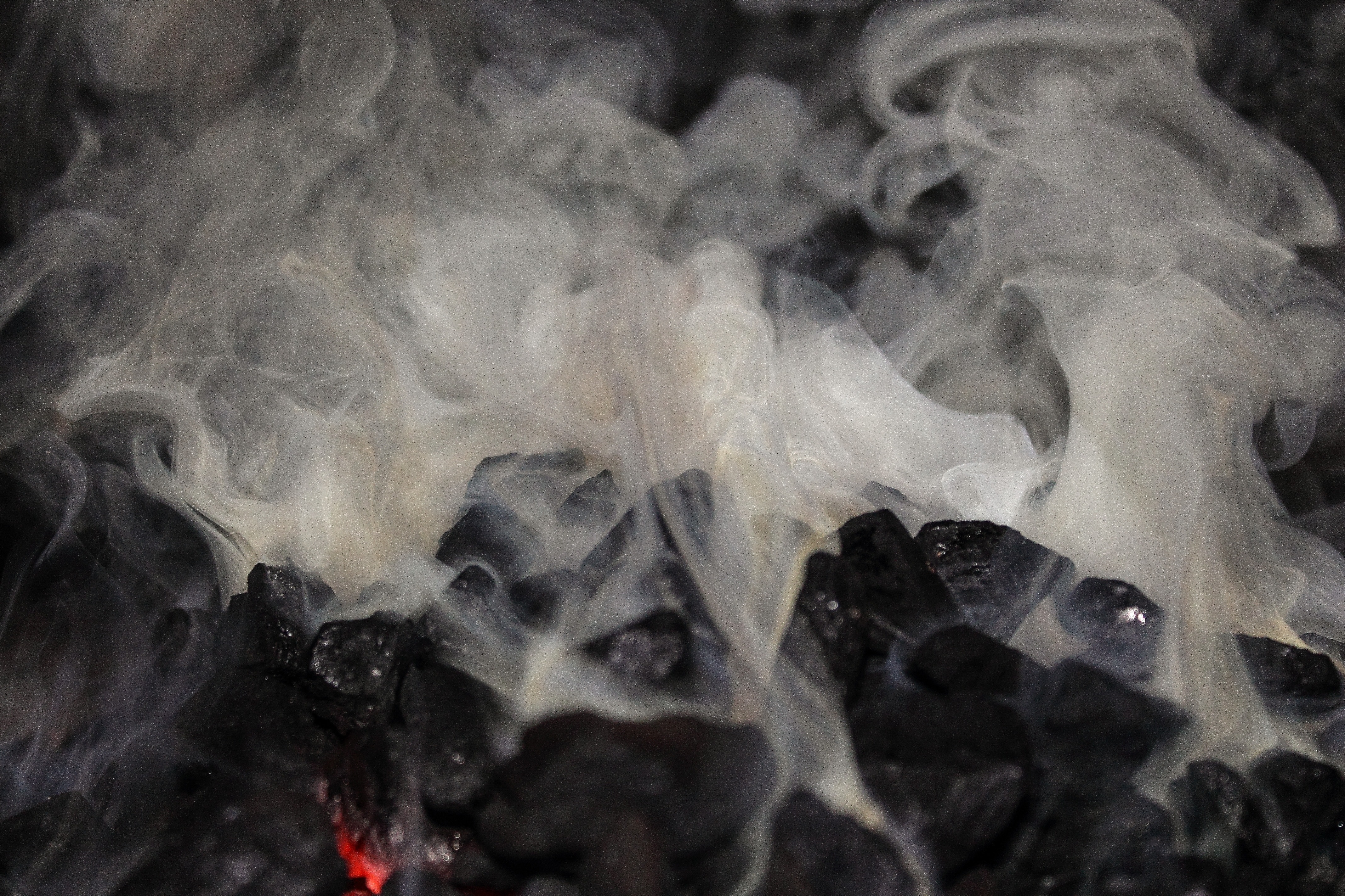burning charcoal and smoke