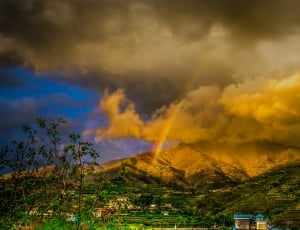 brown mountain with rainbow thumbnail