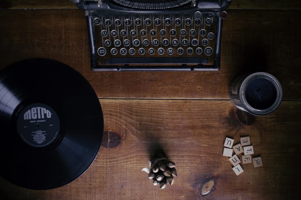 black typewriter and vinyl disc preview