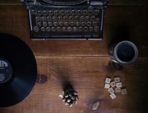 black typewriter and vinyl disc thumbnail