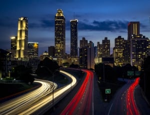 time lapsed photo of cars and high rise buildings thumbnail