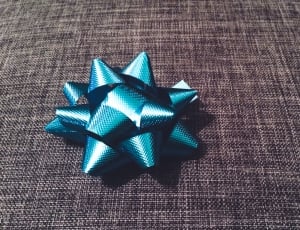 blue lace ribbon on black textile thumbnail