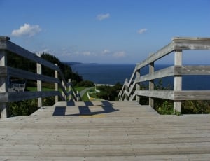 low angle photography of gray wooden stairs thumbnail