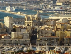 Aerial Photography of Buildings and Ships during daytime thumbnail