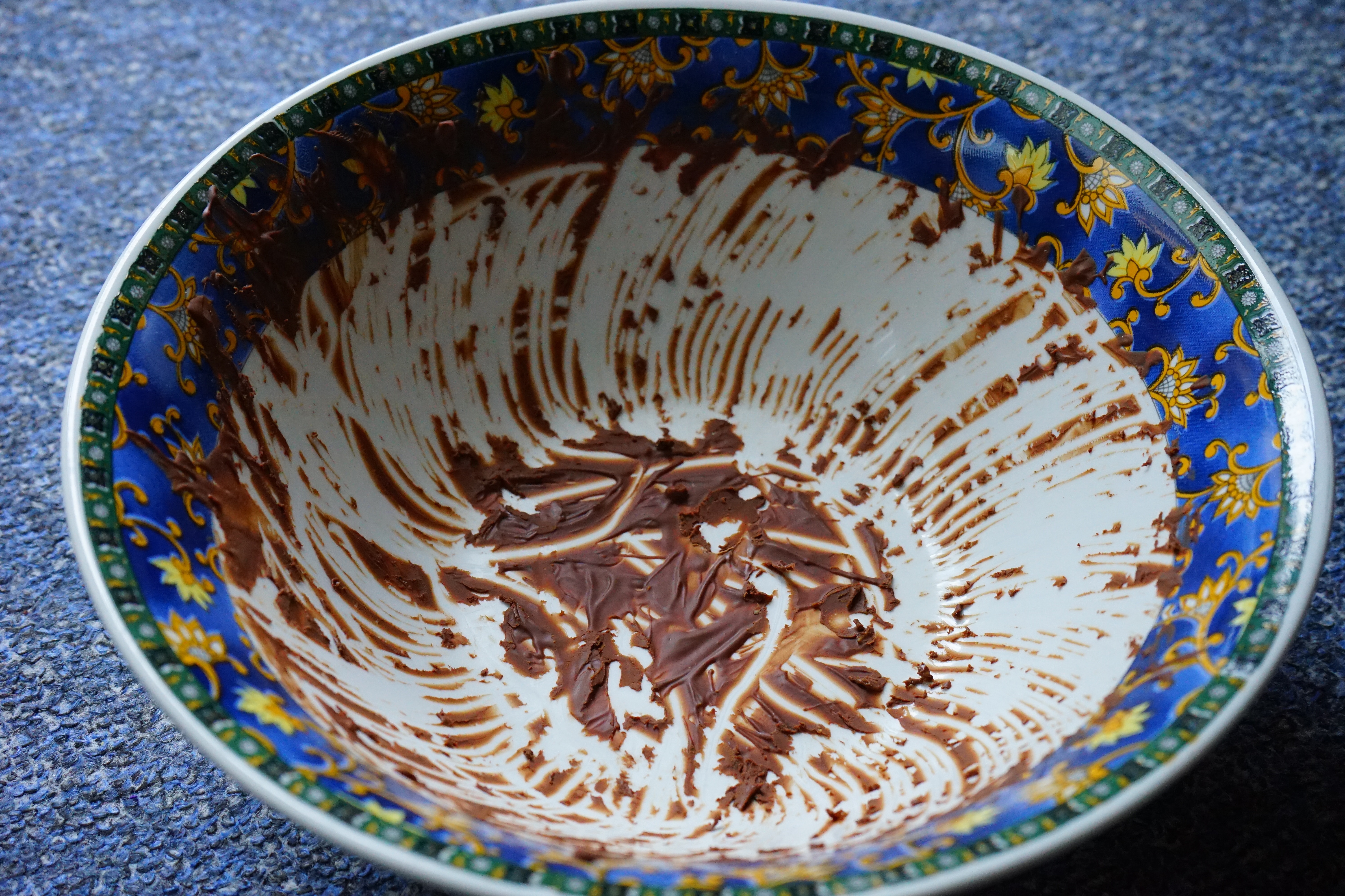 blue white and yellow flower print ceramic bowl with chocolate