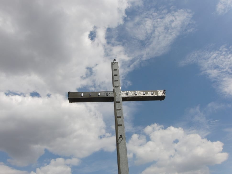 low angle view photography of gray metal cross preview