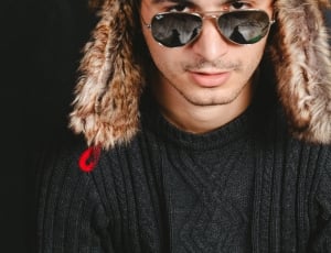 man in black sweater wearing ray ban gold frame aviator sunglasses portrait photography thumbnail