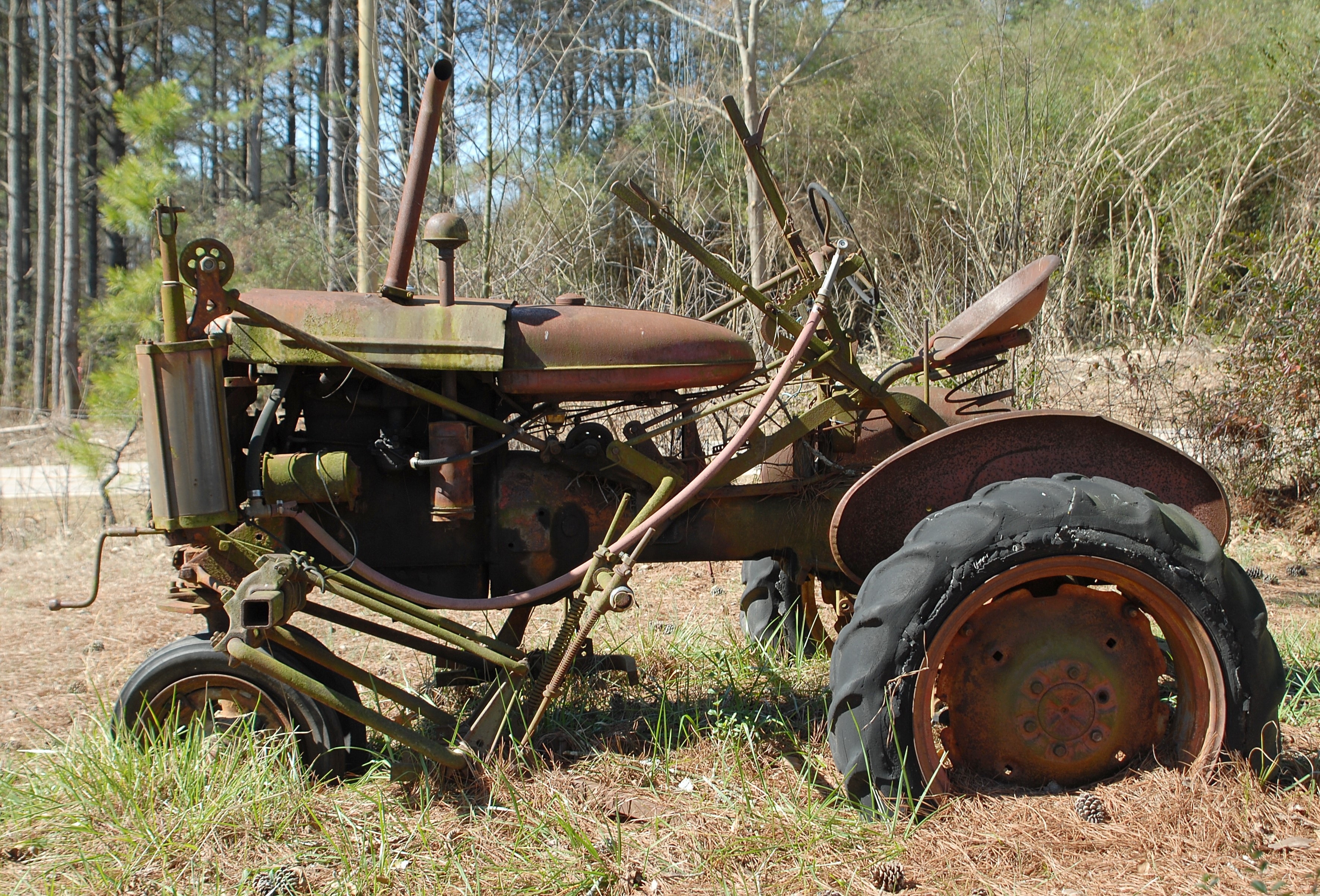 brown farming tractor