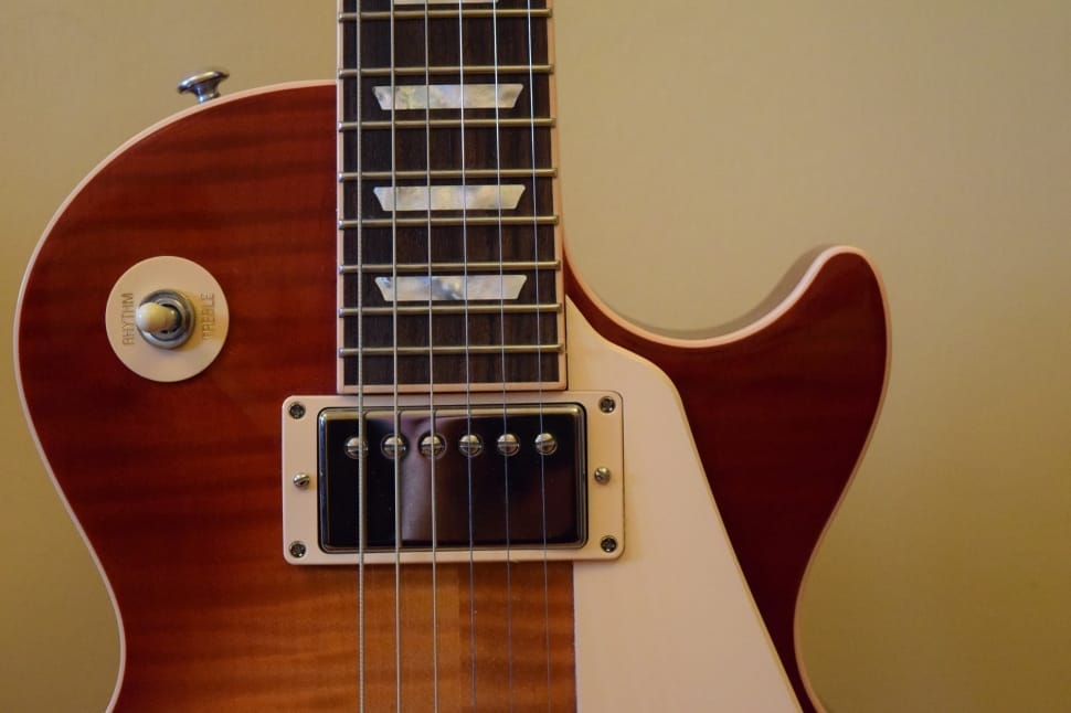 brown and white les paul electric guitar preview
