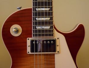 brown and white les paul electric guitar thumbnail
