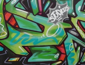 green red and black wall graffiti thumbnail