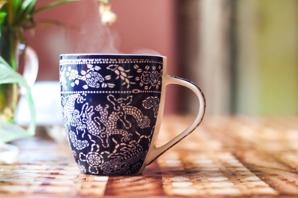 white and black ceramic coffee mug preview