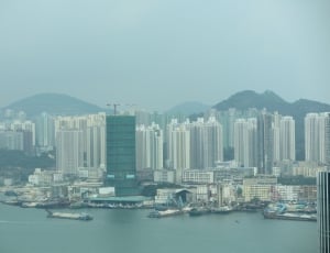 photo of high rise building near body of water during daytime thumbnail