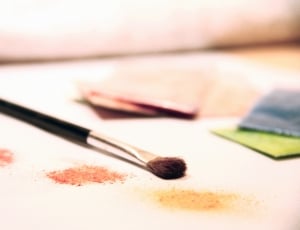 makeup brush on white cushion thumbnail