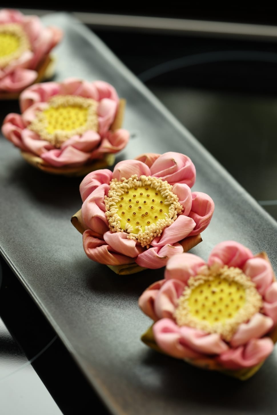 shallow focus of pink and yellow artificial flower preview