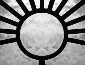 silhouette of plane and cumulus clouds thumbnail