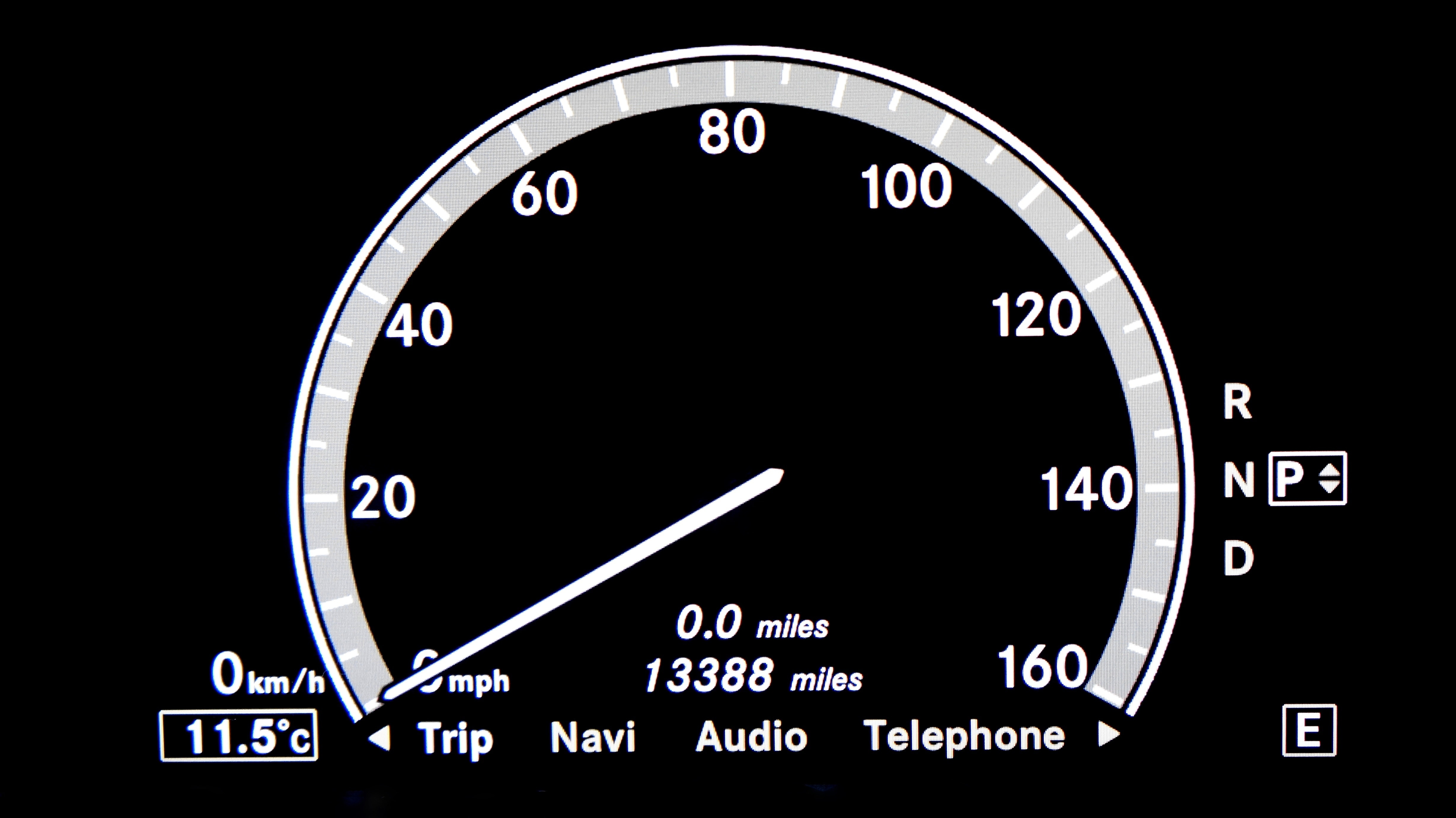 black and white analog speedometer