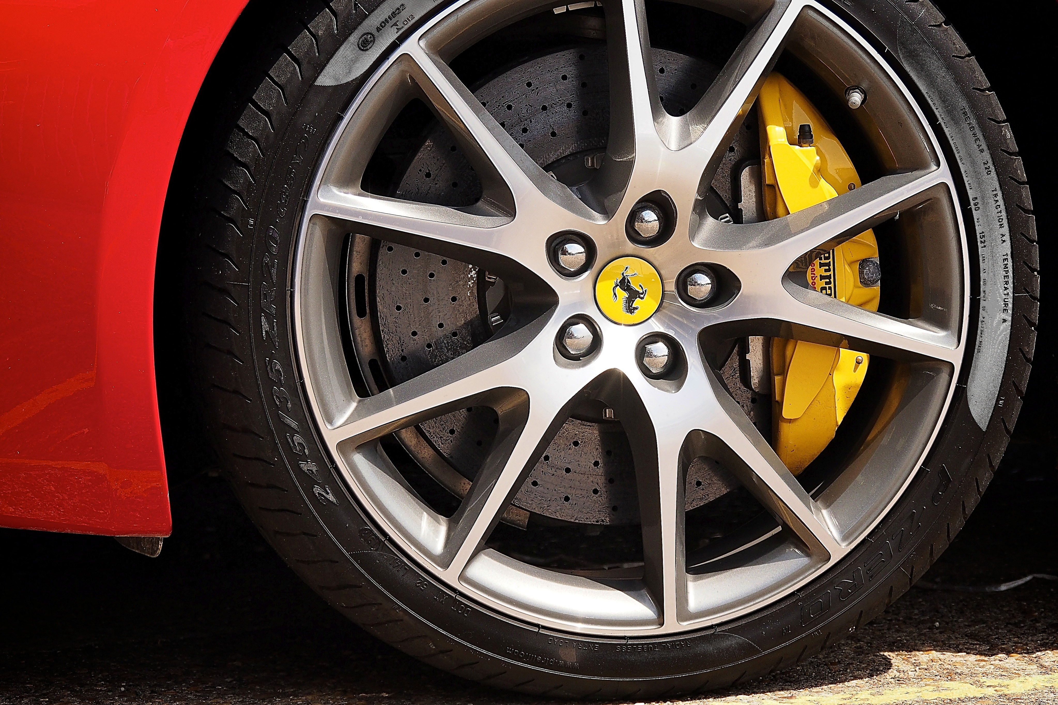 grey ferrari multi spoke wheel with tire